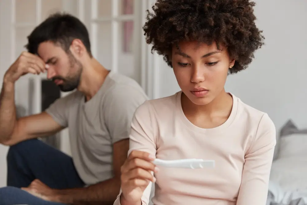 Couple consulting a fertility specialist after repeated pregnancy loss to identify hidden causes of recurrent miscarriage