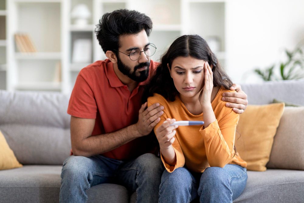Couple discussing fertility evaluation with a doctor